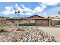 Charming brick home with a two-car garage and low maintenance desert landscaping at 2123 E Radcliffe Dr, Tempe, AZ 85283