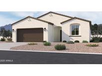 Charming stucco home with a well-maintained lawn, a two-car garage, and desert landscaping at 24090 W Sunland Ave, Buckeye, AZ 85326