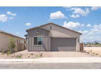 Charming single-story home with a two-car garage, gray trim, and low-maintenance landscaping at 366 E Las Perlas Ln, San Tan Valley, AZ 85140