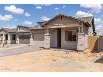 New construction home featuring stucco exterior, tiled roof, paved driveway and stone accents at 3746 E Rochelle Cir, Mesa, AZ 85215
