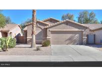 Charming single Gathering home, well manicured desert landscaping, and a spacious two-car garage at 43409 W Sagebrush Trl, Maricopa, AZ 85138