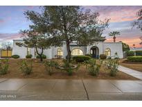 Charming single-story home featuring manicured landscaping and a unique architectural design at 5629 E Thunderbird Rd, Scottsdale, AZ 85254
