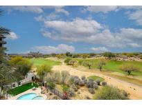 Scenic golf course view with lush green fairways and desert landscape on a sunny, partly cloudy day at 15802 N 71St St # 501, Scottsdale, AZ 85254