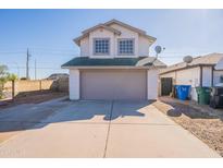 Two-story home with a two-car garage and a concrete driveway at 19437 N 43Rd Dr, Glendale, AZ 85308
