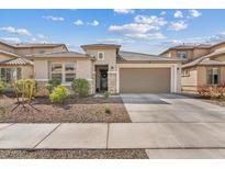 Charming single-story home with a two-car garage and well-maintained landscaping at 23103 E Mewes Rd, Queen Creek, AZ 85142