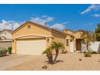 Charming single-story home with a two-car garage, desert landscaping and a well maintained front yard at 3252 E Fremont Rd, Phoenix, AZ 85042