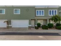 Attractive townhome featuring a two-car garage and desert landscaping at 5206 N 16Th Dr, Phoenix, AZ 85015