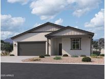 Charming single-story home with a neutral color scheme, two-car garage, and low maintenance landscaping at 5519 S 240Th Ln, Buckeye, AZ 85326