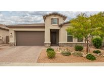 Charming single-Gathering home featuring a well-manicured front yard and a two-car garage at 18025 N 65Th Pl, Phoenix, AZ 85054