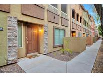 Apartment building exterior showcasing multiple units, varied textures, and a welcoming entrance at 1920 E Bell Rd # 1006, Phoenix, AZ 85022