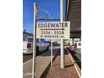 Edgewater community sign with address information and covered parking in a well-maintained neighborhood at 2524 W Berridge Ln # E-213, Phoenix, AZ 85017