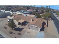 Charming single-Gathering home with a well-maintained brown roof and a convenient attached garage at 6242 E Hearn Rd, Scottsdale, AZ 85254