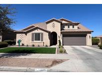Charming single-story home featuring a tile roof, stucco exterior, and well-maintained desert landscaping at 21918 E Maya Rd, Queen Creek, AZ 85142