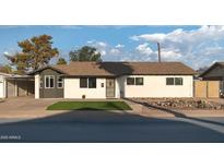 Charming single-story home featuring a landscaped yard and a welcoming front entrance at 6320 N 30Th Dr, Phoenix, AZ 85017
