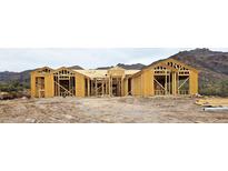 New home under construction with beautiful mountain views in the background at 2669 S Southfork Ranch Rd, Gold Canyon, AZ 85118