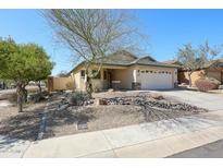 Charming single-story home with a two car garage, xeriscape landscaping, and neutral color palette at 28604 N 21St Ln, Phoenix, AZ 85085