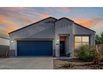 Charming single-story home with a blue garage door and desert landscaping at 5101 E Sharbel Rd, San Tan Valley, AZ 85143