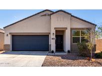 Charming single-story home featuring a two-car garage and low-maintenance desert landscaping at 5101 E Sharbel Rd, San Tan Valley, AZ 85143