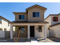 Charming two-story home with a cozy front porch and craftsman architectural details at 15586 S 181St Dr, Goodyear, AZ 85338