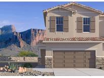 Inviting two-story home featuring a two car garage and beautiful desert landscaping at 21216 N 58Th St, Phoenix, AZ 85054