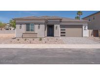 Beautiful single-story home with a modern design, desert landscaping, and a two-car garage at 40165 N Alameda Dr, San Tan Valley, AZ 85140