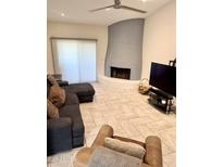 A bright living room features a unique fireplace and plush seating at 8302 N 21St Dr # L204, Phoenix, AZ 85021