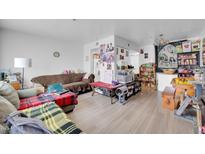 Comfortable living room with a couch and an interesting open floorplan; the room is brightly lit and welcoming at 12123 W Bell Rd # 315, Surprise, AZ 85378