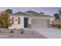 Charming single-story home featuring neutral tones, well-kept landscaping, and an attached two-car garage at 12552 W Trumbull Rd, Avondale, AZ 85323