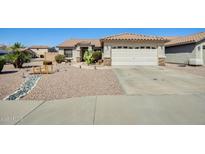 Charming single-story home featuring a desert landscape, walkway and two-car garage at 15412 N 160Th Ln, Surprise, AZ 85374
