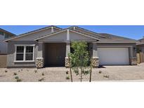 Charming single-Gathering home with desert landscaping, covered porch, and attached two-car garage at 19072 E Caledonia Dr, Queen Creek, AZ 85142