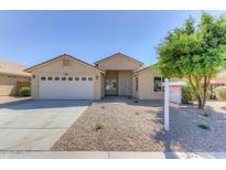 Charming single-story home featuring a two-car garage, neutral stucco, and desert landscaping at 1919 W Nancy Ln, Phoenix, AZ 85041