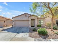 Charming single-story home featuring a two-car garage and desert landscaping at 29081 N Cactus Cir, San Tan Valley, AZ 85143