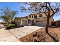 Beautiful stucco home with a three-car garage and well-manicured landscaping at 29374 N 125Th Dr, Peoria, AZ 85383