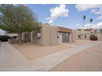 Charming single-story home featuring a desert landscape and private entrance at 4719 E Belleview St, Phoenix, AZ 85008