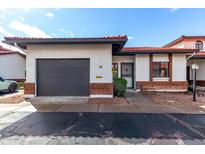 Charming single-story home featuring a private garage and a welcoming front entrance at 501 E 2Nd Ave # 14, Mesa, AZ 85204