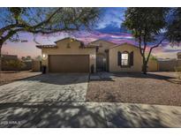 Inviting single-story home boasting a two-car garage and attractive desert landscaping at 7015 S Stadium Ct, Gilbert, AZ 85298