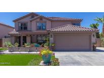 Charming two-story home with a well-manicured lawn and inviting front porch at 3397 E Derringer Way, Gilbert, AZ 85297