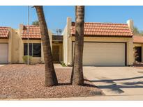 Charming single-story home featuring a tile roof, desert landscaping, and a two-car garage at 5342 S Farmer Ave, Tempe, AZ 85283