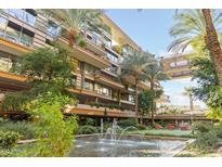 Beautiful courtyard with fountains, lush landscaping, and comfortable seating areas at 7157 E Rancho Vista Dr # 3009, Scottsdale, AZ 85251