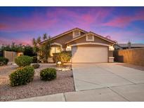 Charming single-story home with a well-maintained yard and attached two-car garage at 7471 E Desert Vista Rd, Scottsdale, AZ 85255