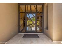 Close up of decorative and modern glass front door at 9440 N Sunset Rdg, Fountain Hills, AZ 85268