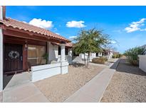 Inviting single-story home with cozy covered patio and low maintenance desert landscaping at 10807 W Northern Ave # 113, Glendale, AZ 85307