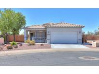 Charming single-story home featuring a well-maintained desert landscaped yard and a spacious two-car garage at 1825 E Sycamore Rd, Casa Grande, AZ 85122
