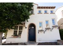 Charming two-story home with a blue front door and flower boxes under the windows at 2918 N 48Th Pl, Phoenix, AZ 85018