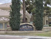 Bella Terra Condominiums sign at Paradise Valley with mature landscaping and a view of the property behind the sign at 5335 E Shea Blvd # 1035, Scottsdale, AZ 85254