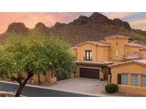 Beautiful desert home featuring a tile roof, stucco walls, multiple garages, and desert landscaping with mountain views at 5370 S Desert Dawn Dr # 50, Gold Canyon, AZ 85118
