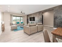 Bright living room featuring modern decor, tile floors, and large windows with mountain views at 544 E Amber Sun Dr, Phoenix, AZ 85086