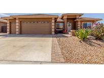 Charming single-Gathering home with a xeriscaped front yard and a spacious two-car garage at 11121 E Onza Ave, Mesa, AZ 85212