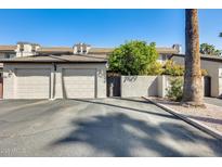 Charming townhouse featuring attached two-car garage, lovely trees, and convenient front access at 2338 W Lindner Ave # 22, Mesa, AZ 85202