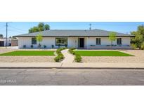 Charming single-story home with manicured front yard and desert landscaping at 2712 N 20Th Dr, Phoenix, AZ 85009